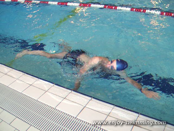 A man swimming sidestroke