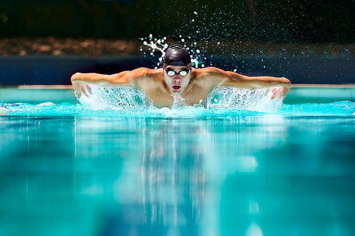 A man swimming the butterfly stroke