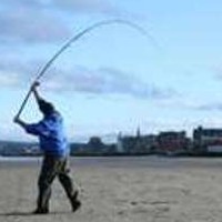 Surfcasting on the Beach With Safety Precaution