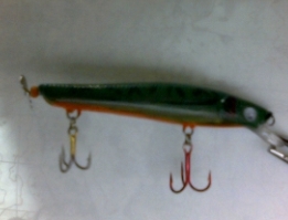 Hand painted jerkbait with propeller on end.
