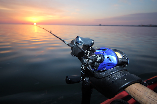 Rod in the holder, sun on the rise and a strong belief a fish will bite — that's the kayaker's life. Photo Jeff Moag