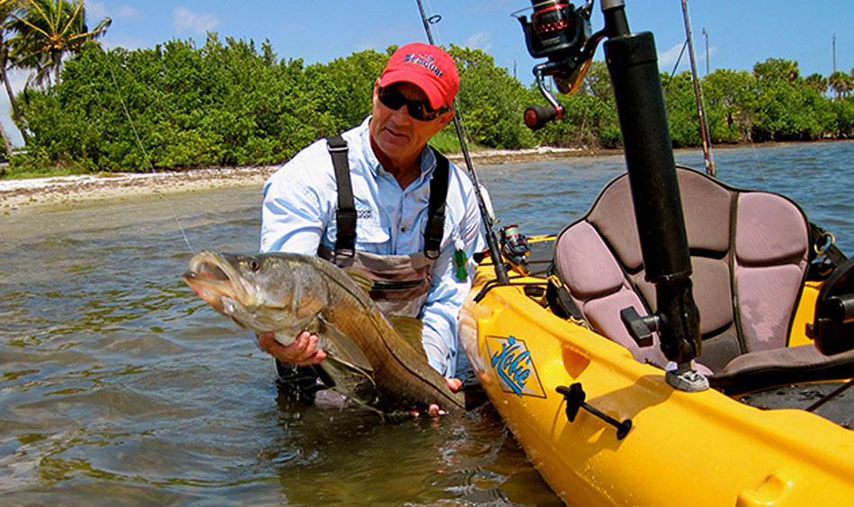 IF YOU MUST grip and grin, the horizontal handle is easiest on the fish. PHOTO BY JERRY MCBRIDE