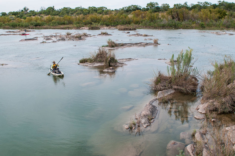 DAVIES BREAKS OUT UNCONVENTIONAL TECHNIQUES TO LASSO TROPHY BASS ON SKINNY TEXAS RIVERS. PHOTO BY AARON SCHMIDT