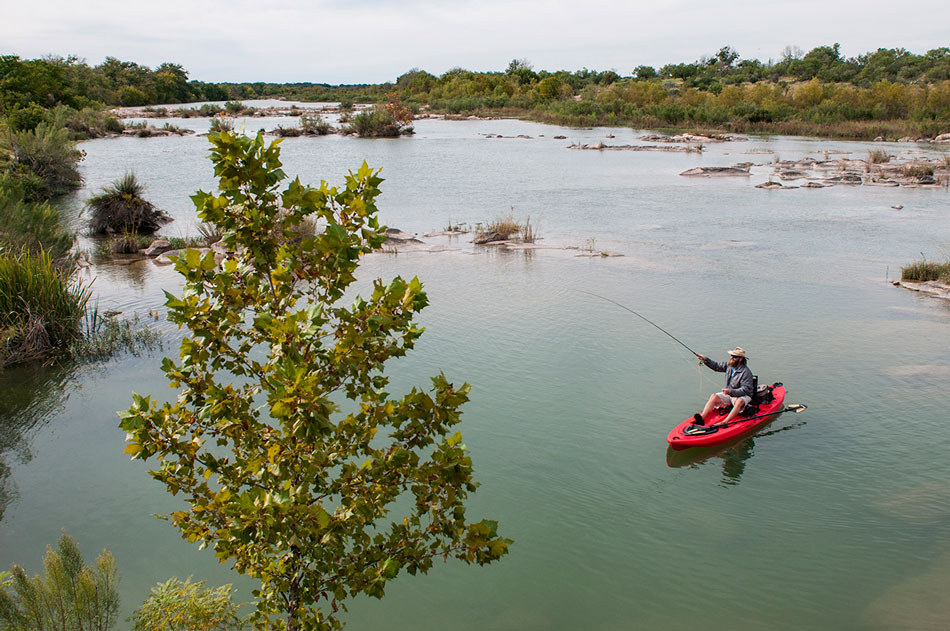 AMBUSH ALLEY: Looking shallow for bass can turn up hefty spring and summer largemouth. PHOTO BY AARON SCHMIDT.