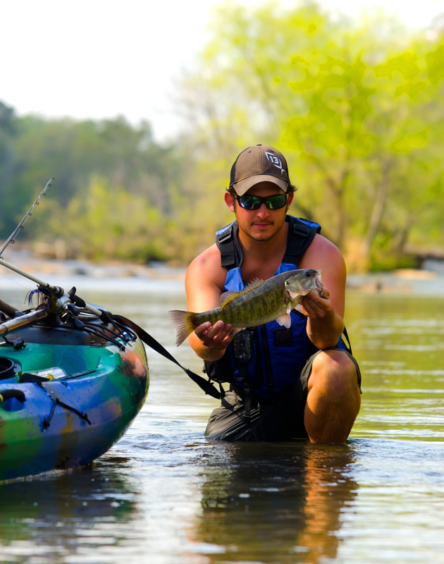 Choose your focus point carefully to alter the mood of your photos. This one puts the spotlight on the angler and his fish. 