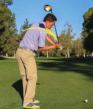 f you're fixated on the clubhead at the top of your swing, you'll likely swing from over the top as you see here, which, by the way, rarely produces good results!