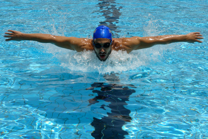 A butterfly stroke swimmer outdoors