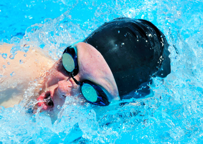 Close-up of a female swimmer breathing in the front crawl