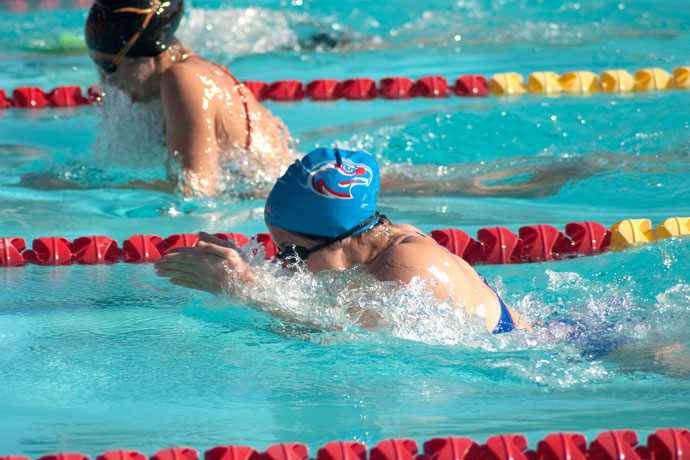 Two breaststroke swimmers starting the arm recovery