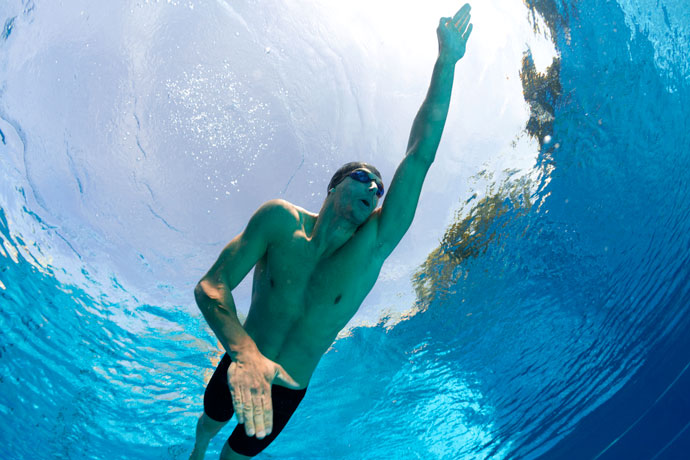 A front crawl swimmer seen from below