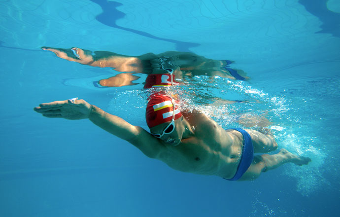 A front crawl swimmer, shot from underwater