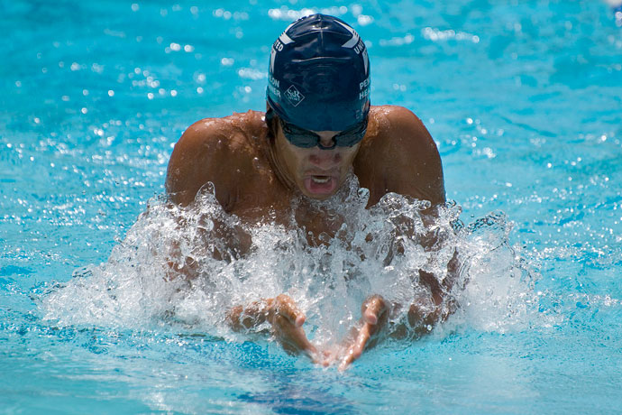 A breaststroke swimmer breathing during the arm recovery