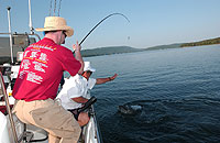 Ian struggles to land a striped bass. (CH)