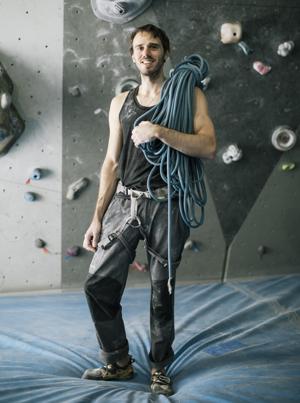 Bouldering climber on mat