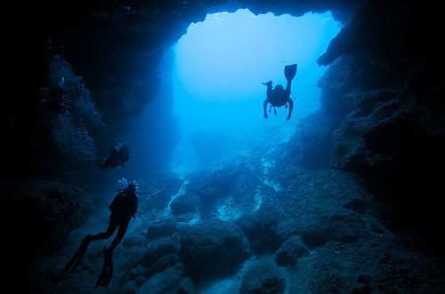 divers in a cave