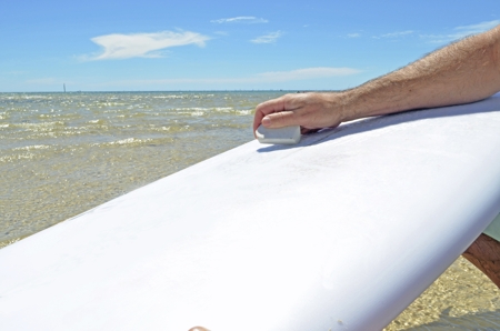 Waxing Surfboard