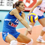 A lady practicing volleyball drills.