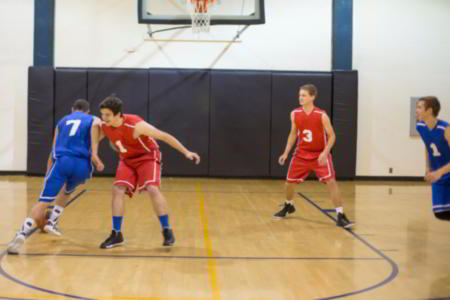 Teenagers playing basketball